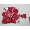 Petits bonbons durs  coeur emballés individuellement (goût cerise)